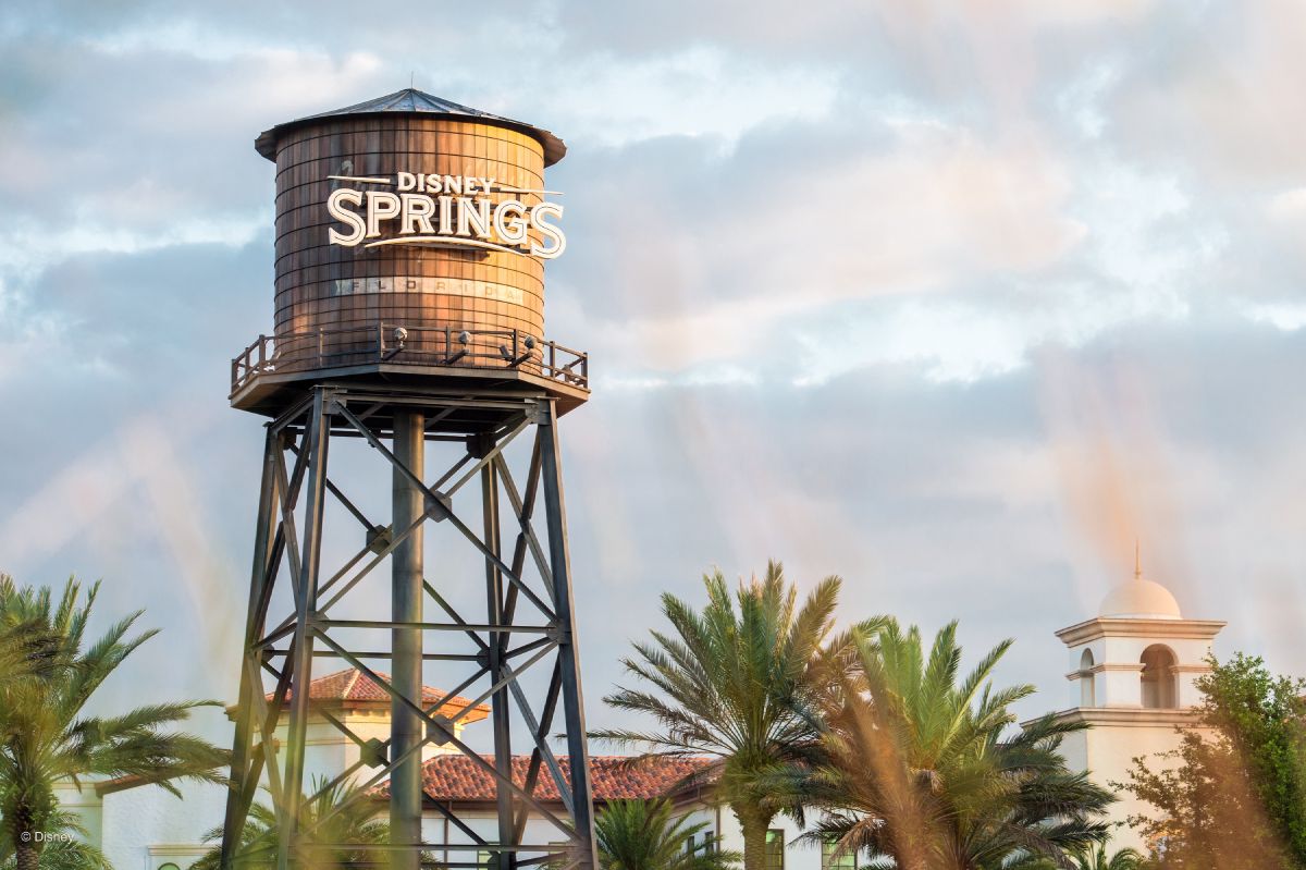 The iconic water tower rises above the shops and walkways of Disney Springs at Walt Disney World Resort, a dining, shopping, and entertainment district that requires no theme park ticket.