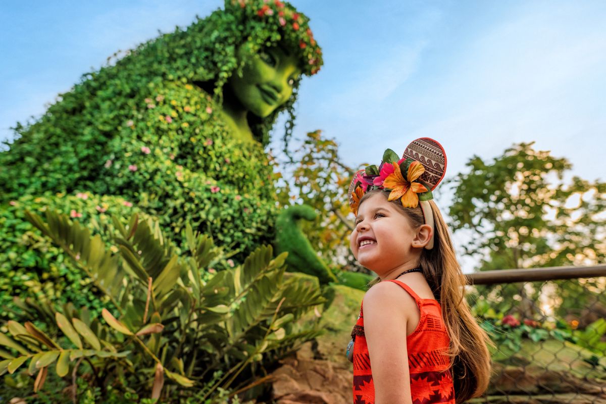 A young girl plays in the water features at Journey of Water Inspired by Moana at EPCOT, one of the interactive attractions in the World Nature neighborhood.