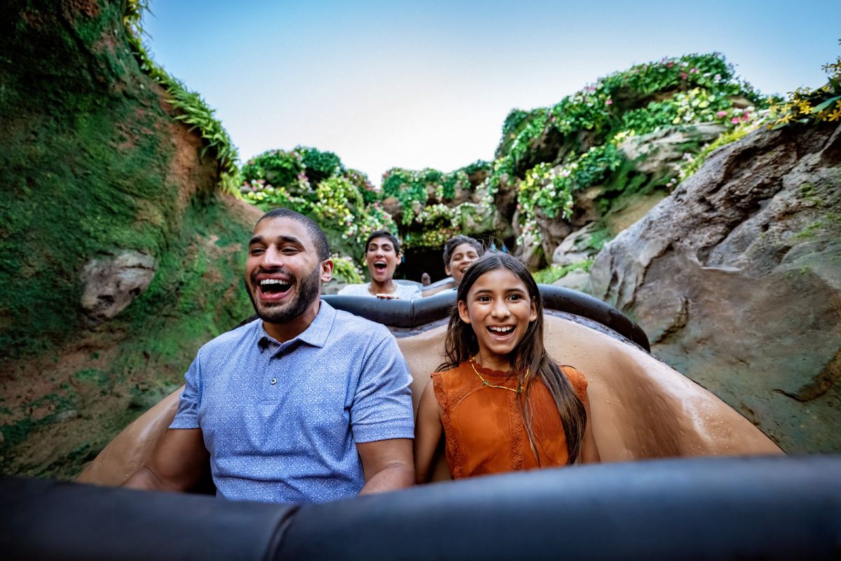 A family laughs with excited expressions while riding Tiana's Bayou Adventure at Magic Kingdom Park, Walt Disney World Resort.