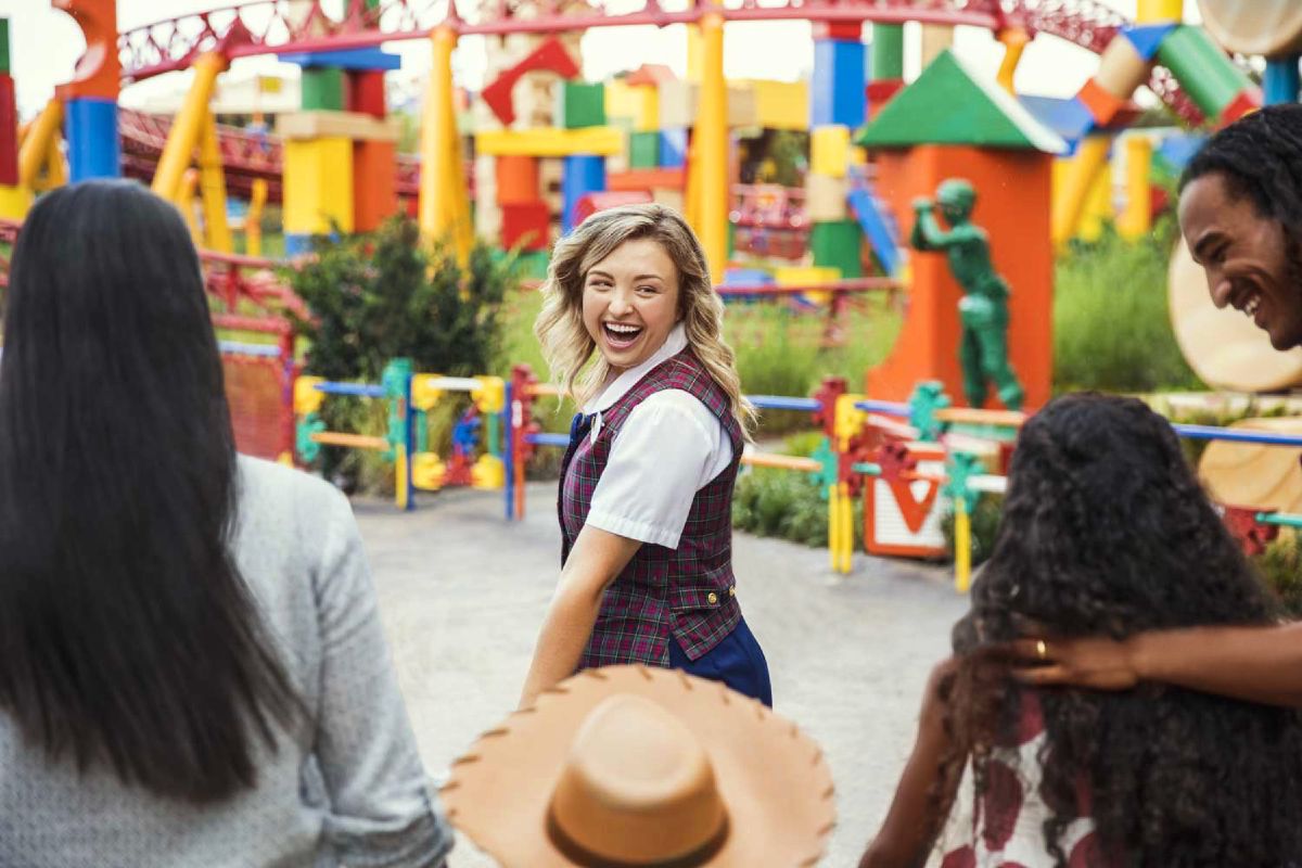 A family poses together in Toy Story Land at Disney's Hollywood Studios during a VIP tour at Walt Disney World Resort.
